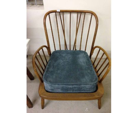 An Ercol armchair.