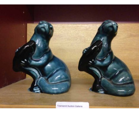 2 Poole Pottery otters.