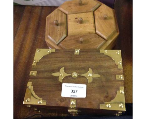 A small wooden trinket box with brass fittings with a wooden tea selection box.