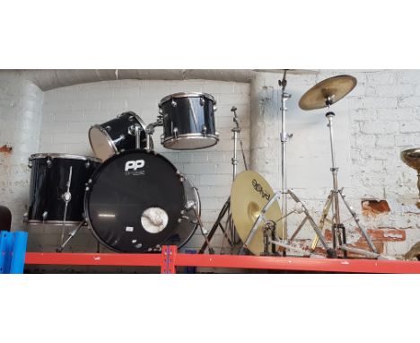A 4 piece drum kit including bass drum, 2 toms and a floor standing tom, cymbals etc
