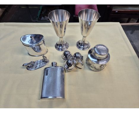 A box of silver plated ware to include tea caddies, Art Deco hip flask, pair of Welsh goblets and desk weight featuring a far