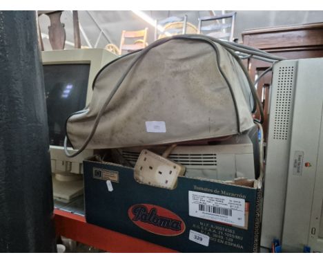 A computer hard drive, vintage Apple monitor, electric typewriter etc