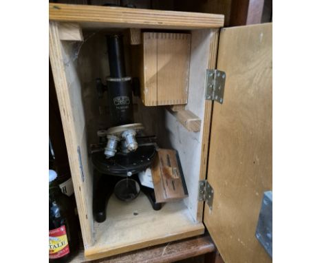 A Carl Zeiss Jena microscope in wooden case. 