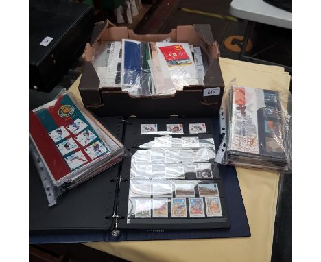 A file of assorted stamps and a box of assorted first day covers.