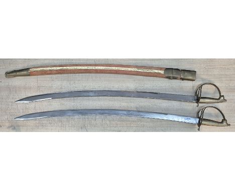 Two brass handled indian swords, one with scabbard.
