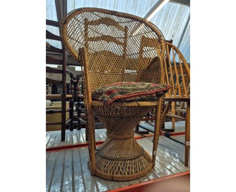 A vintage wicker peacock chair. 