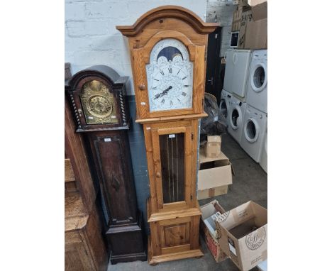 A German chiming longcase clock with rolling mood dial, complete with weights and pendulum.