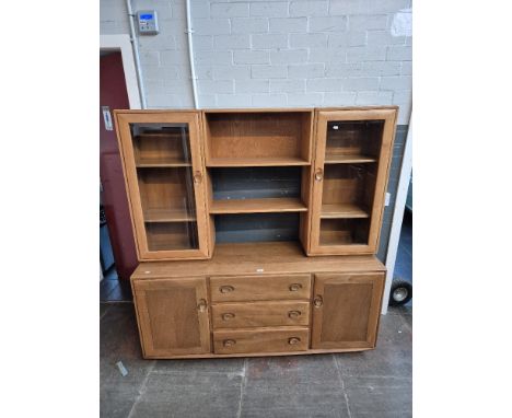 An Ercol light elm 'Windsor' sideboard/display cabinet. 