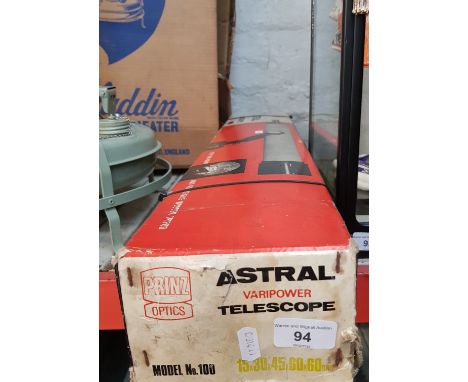 A Prinz Astral telescope and tripod, in box.