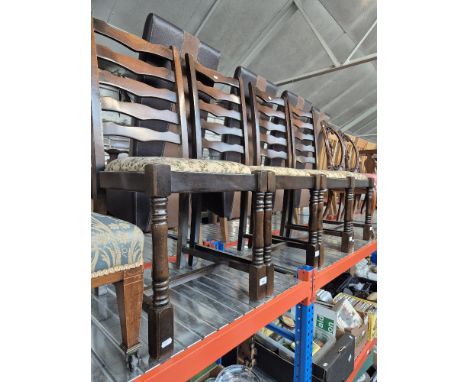 A set of four ladder back dining chairs. 