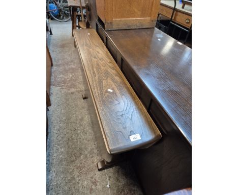 An Ercol elm drop leaf dining table. 