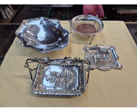 A box of Art Nouveau, silver plated ware to include planished basket, inkwell on stand, strawberry basket and pierced bottle 