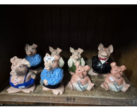 Eight Wade Natwest pigs. 