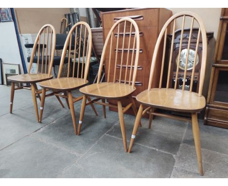 A set of four vintage Ercol light elm 'Quaker' chairs, model 365, with 1960s blue and gold labels.