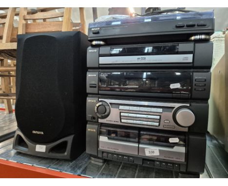 An Aiwa HiFi system comprising record player, twin tape decks, radio, CD player and speakers.