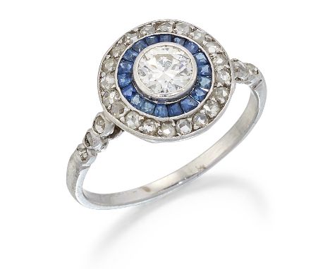 AN ART DECO SAPPHIRE AND DIAMOND CLUSTER RING, an old European-cut diamond within a border of calibré-cut sapphires and rose-