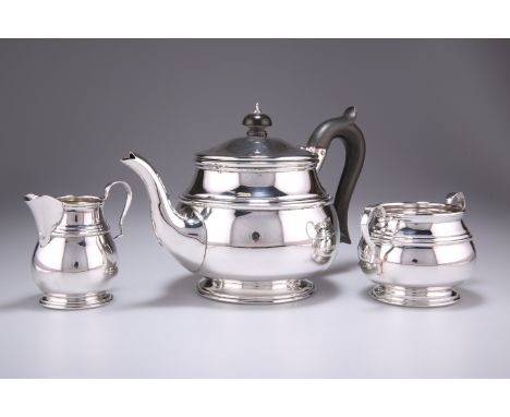 A GEORGE V SILVER THREE-PIECE TEA SERVICE,&nbsp;by&nbsp;Deakin &amp; Francis Ltd, Birmingham 1922, comprising teapot, cream j