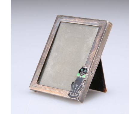 AN ART DECO SILVER AND ENAMEL NOVELTY PHOTOGRAPH FRAME,&nbsp;by&nbsp;Alfred Dunhill &amp; Sons, London 1939, the small frame 