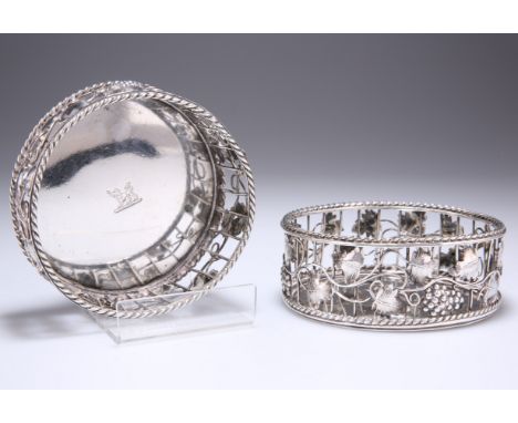 A PAIR OF GEORGIAN SILVER COASTERS,&nbsp;possibly by William Plummer,&nbsp;circular, the gallery edge surrounded by trailing 