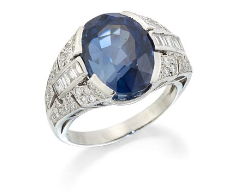 AN ART DECO STYLE CEYLON SAPPHIRE AND DIAMOND RING, a cushion-cut sapphire in a tension setting to baguette and round brillia