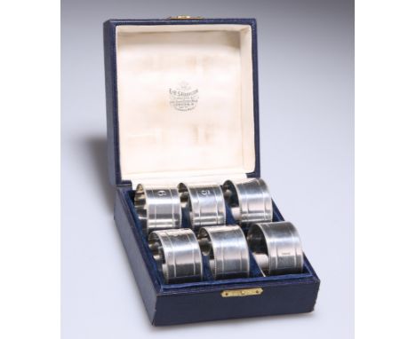 A GEORGE V SET OF SIX SILVER NAPKINS,&nbsp;by James Dixon &amp; Sons Ltd, Sheffield 1917, circular, plain with beaded rims, e