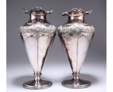 A LARGE PAIR OF ART NOUVEAU SILVER-PLATED VASES, of shouldered conical form with undulating rim, chased with stylised foliage
