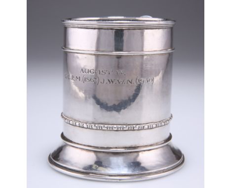 AN ARTS AND CRAFTS SILVER MUG,&nbsp;by Omar Ramsden, London 1930, the lightly planished body with stepped reeded rim, engrave