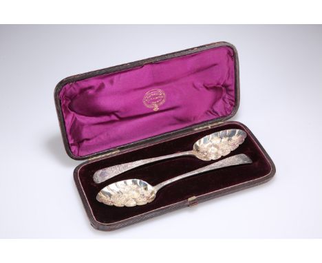 A NEAR PAIR OF GEORGE III SILVER BERRY SPOONS,&nbsp;by Alice and George Burrows II, London 1802 and 1808, cased, the bowls en