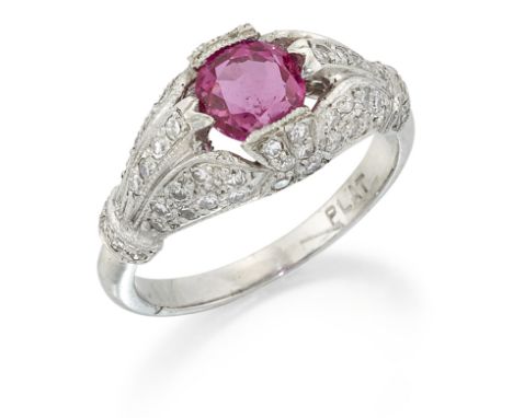 A BURMA RUBY AND DIAMOND RING, a round-cut ruby within a fancy milgrain boule-shaped frame pavé-set with eight-cut diamonds, 