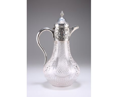 A LATE VICTORIAN SILVER-MOUNTED CUT-GLASS CLARET JUG,&nbsp;Birmingham 1899, of baluster form with domed hinged cover and S-sc