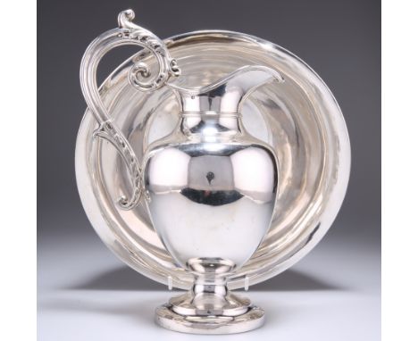 A FRENCH SILVER WATER EWER AND BASIN, by&nbsp;Désiré&nbsp;Thorel, Paris, c.1890, the ewer of baluster form, raised on a stepp