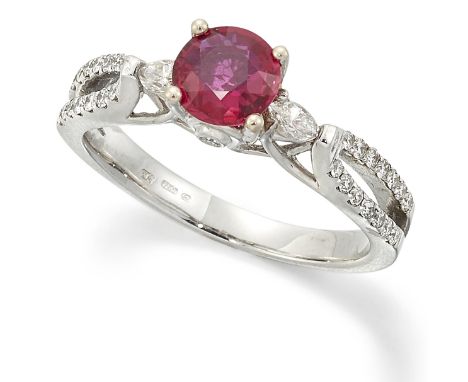 AN 18 CARAT WHITE GOLD RUBY AND DIAMOND RING, a round-cut ruby spaced by marquise-cut diamonds and above a diamond set galler