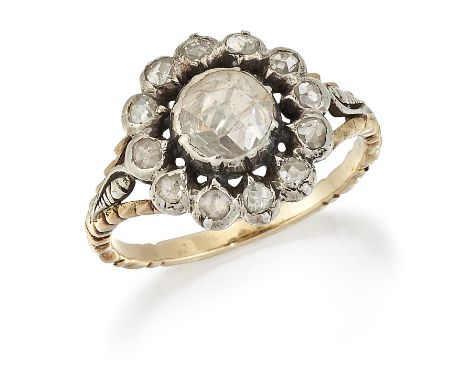 A DIAMOND CLUSTER RING, a rose-cut diamond in a foiled setting within a pierced border of smaller rose-cut diamonds, to fancy