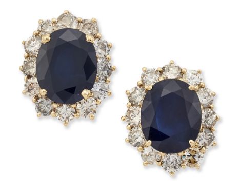 A PAIR OF 18 CARAT GOLD SAPPHIRE AND DIAMOND CLUSTER EARRINGS,&nbsp;each with an oval-cut sapphire within a border of round b