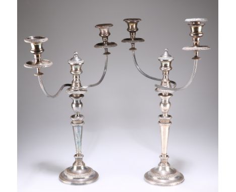 A PAIR OF OLD SHEFFIELD PLATE CANDELABRA, each with reeded scrolling branches and beaded bands. 55.5cm high