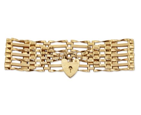A 9 CARAT GOLD GATE LINK BRACELET, alternating twisted and straight long bar links, spaced by short brick links, to a 9 carat