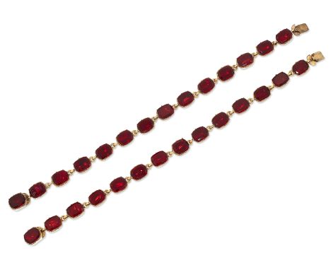 A PAIR OF PASTE RIVIÈRE BRACELETS, each link with a foiled cushion-cut red paste, in a crimped collet setting. Length 17.5 gr