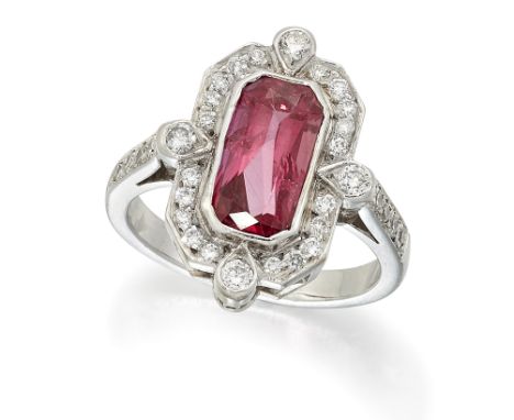 A RUBY AND DIAMOND RING, an octagonal-cut ruby within a diamond set octagonal frame, to diamond set shoulders, total estimate