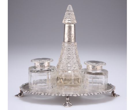 AN EDWARDIAN PAIR OF SILVER CAPPED INKWELLS,&nbsp;by James Dixon &amp; Sons Ltd, Birmingham 1901, of shaped circular form, ci