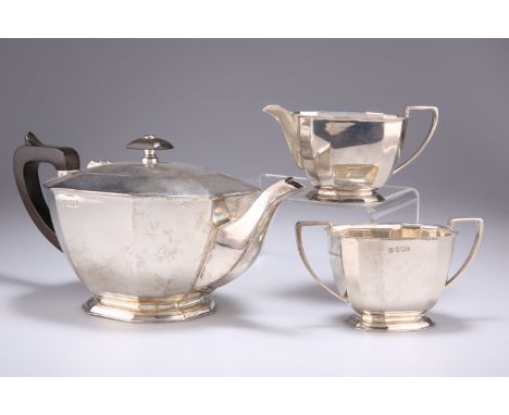 AN ELIZABETH II SILVER THREE PIECE TEA SERVICE,&nbsp;by Cooper Brothers &amp; Sons Ltd, Sheffield 1968, of tapering sectional