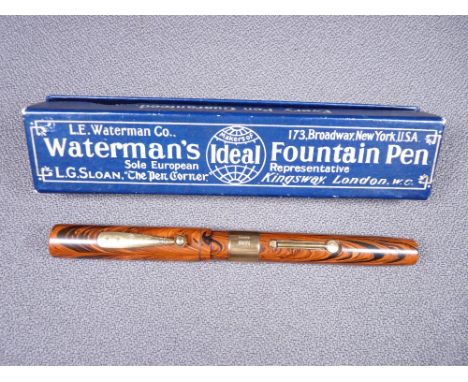 WATERMAN - Vintage 1920s red ripple Waterman's Ideal 55 fountain pen in hard rubber with gold filled trim, wide gold band to 