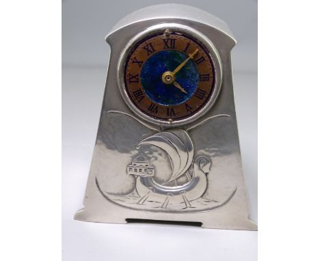 LIBERTY &amp; CO PEWTER &amp; ENAMEL CLOCK, designed by Archibald Knox, 12cms H, of tapering out form with stylized galleon u