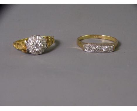 TWO EIGHTEEN CARAT GOLD DIAMOND SET DRESS RINGS including a five stone example in a trough setting, 2.9grms, size mid Q-R and