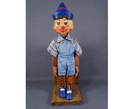 WOODEN PINOCCHIO PUPPET in the form of one bookend