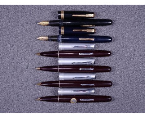 WATERMAN - Two vintage 1947/8 maroon Waterman Crusader Taperite fountain pens with 14ct gold nibs, chrome trim and 'Lumalloy'