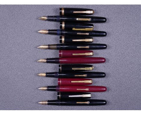 WATERMAN - Two vintage (late 1940s) Waterman Taperite fountain pens - one black, one maroon - with 14ct gold nibs and gold tr