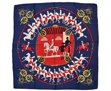 Twill scarf "Manège". HERMES 90 cm scarf in twill silk, red background and navy blue frame, signed Philippe Ledoux. This mode
