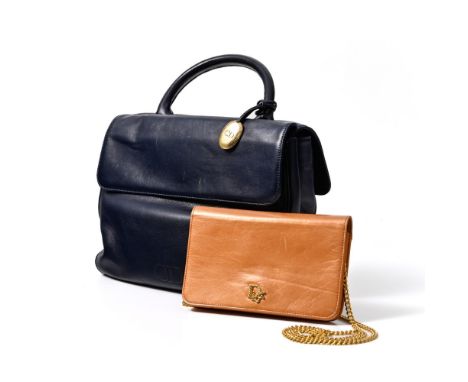 Day &amp; Night set Christian DIOR Including: - A city bag in smooth navy blue leather with two independent compartments, sna