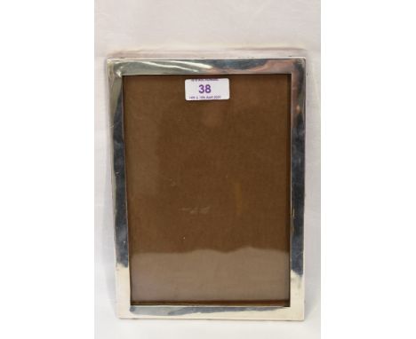 A silver photograph frame of plain form having a wooden easel back, Birmingham 1922, Charles S Green &amp; Co Ltd
Condition R