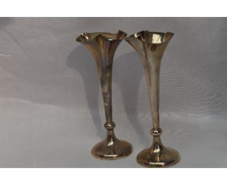 A pair of Edwardian silver bud vases having indented frilled rims and weighted bases, London 1909, Horace Woodward &amp; Co
A